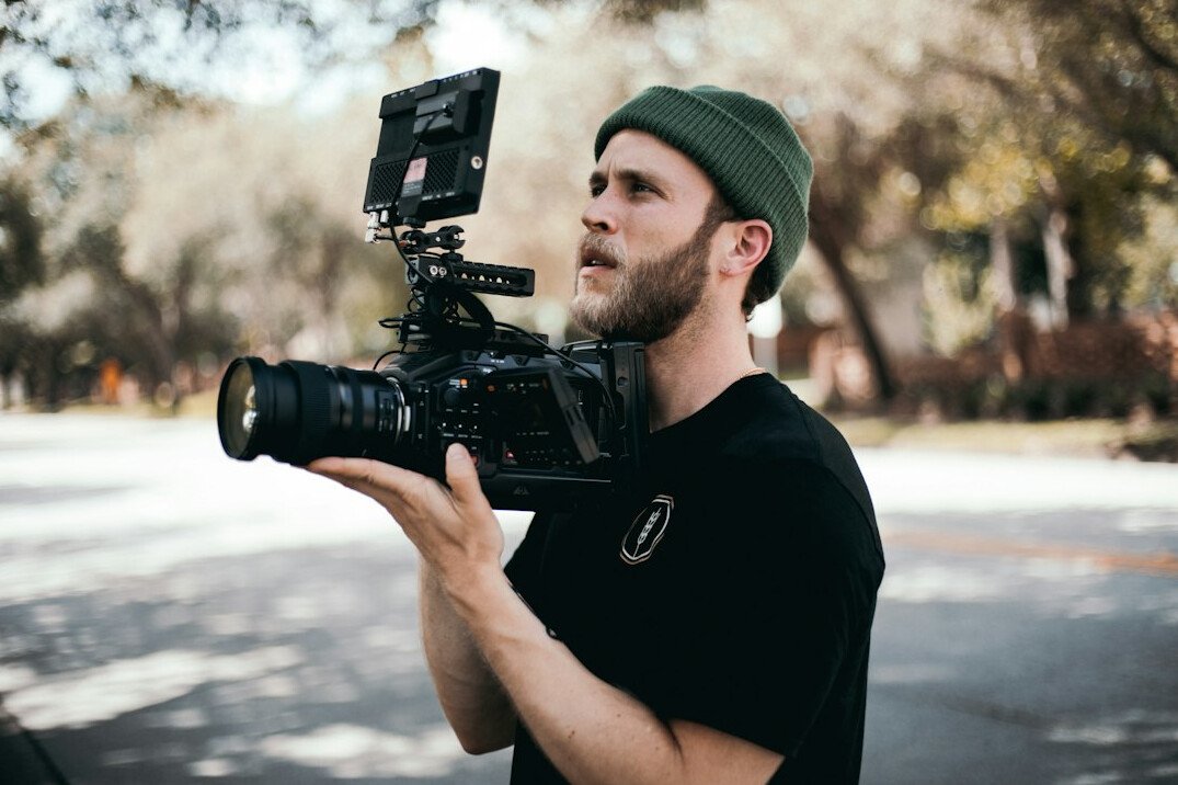 filmmaker using camera on set